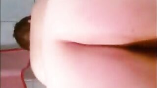 Slutty woman spreads her ass wide open while sitting on the toilet