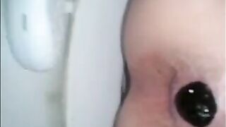 Woman takes a huge shit while sitting on the toilet