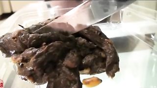 Young babe shitting on a plastic toilet