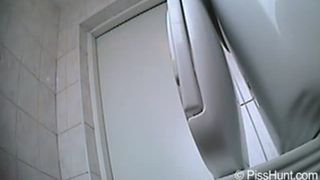 Sexy girl peeing over the toilet