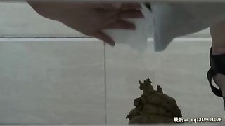 Chinese girl using a public bathroom