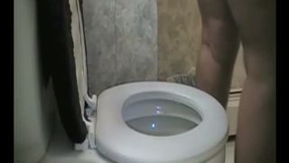 Fat lady pooping in the toilet