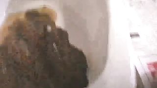 Japanese girl shitting in a bucket