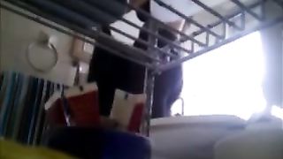 Sexy brunette MILF caught stripping in kitchen