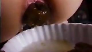 Hot wife pooping a lot on a white plate