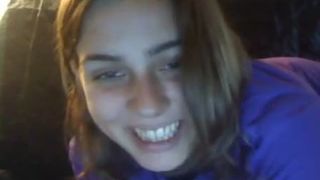 Beautiful brown haired teen smearing crap on her face