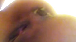 Her shaved ass in close up while pooping