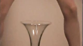 Blonde nurse peeing into a champagne glass