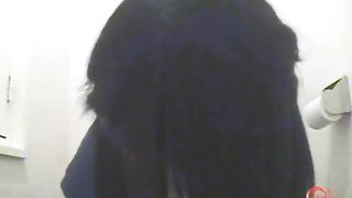 Japanese school girl using a public bathroom