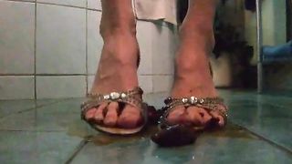 Shitting on her good gold sandals