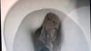 Vintage video of a brunette milf shitting a big one