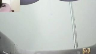 Constipated girl almost crying in a public bathroom