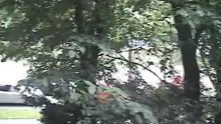 Young woman pooping in a public park