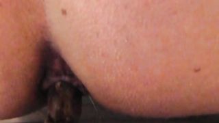 Hot MILF shitting a brown turd in close up