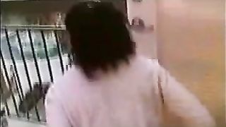 Black girl pooping on a balcony