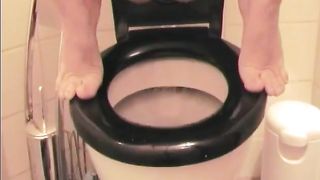 Sexy teen dropped a long turd over the toilet