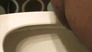 Fat ebony pooping in a toilet