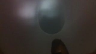 Long brown turd over the toilet