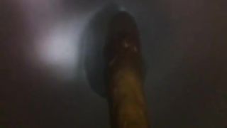 Long brown turd over the toilet