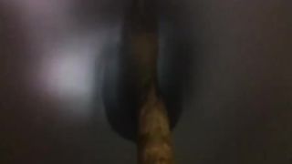 Long brown turd over the toilet