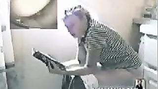 Vintage video of a blonde woman pooping