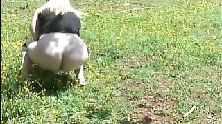 Fat blonde shitting into a public park