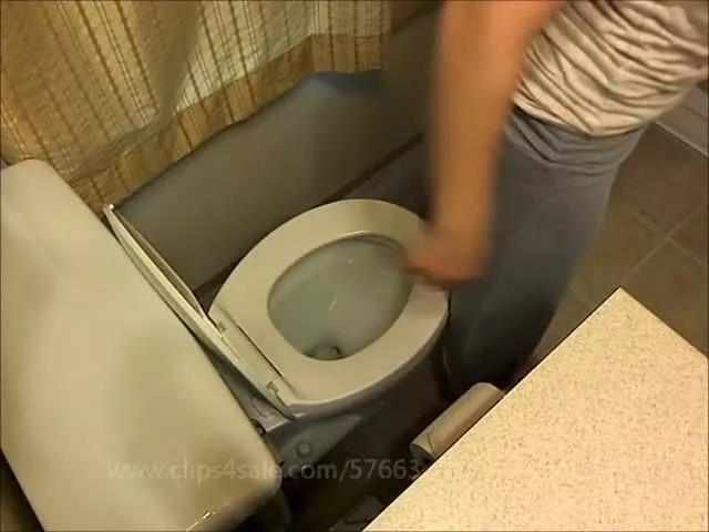 Sexy college girl caught pooping in dorm toilet