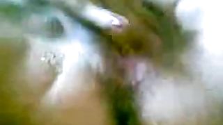 Fingering her pussy after peeing in a glass