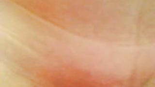 Sexy girl records her shaved pussy in close up while peeing