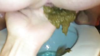Wife pooping on her husband hands