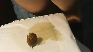 Farting a tiny turd from her butthole