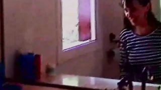 Young brunette lady shitting over the toilet