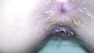 Close up of a shaved wife pooping