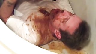 Male slave trying to drink diarheea