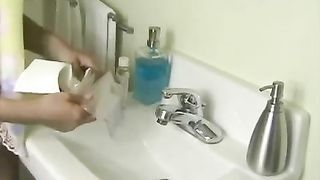 Brunette teen doing enema cause she wants to poop in her pan