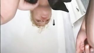 Blonde girl shitting on the bathroom floor