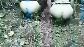 Two best friends pooping together in nature