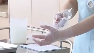 Chinese nurse doing enema to her patient