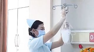 Chinese nurse doing enema to her patient