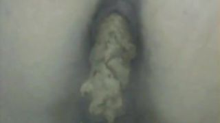 Young beauty shitting in a public bathroom