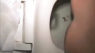 Young college girl using a public bathroom