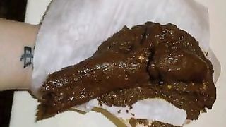 Beautiful teen pooping on a white napkin