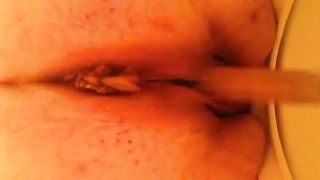 Fat woman pooping in toilet in close up