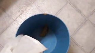 Sexy girl cleaning scat bucket with warm water