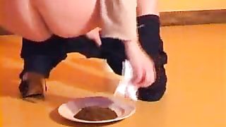 Hot brunette pooping liquid shit on a plate