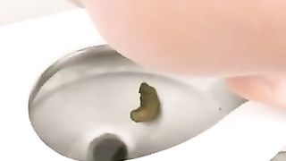 Brunette Curly teen pooping on white floor