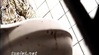 Mature blonde granny shitting in public bathroom