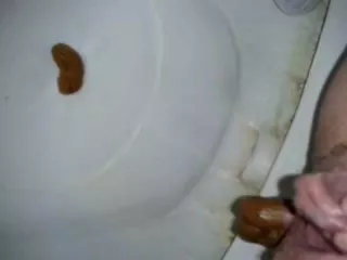 Dropped a long red turd in the toilet