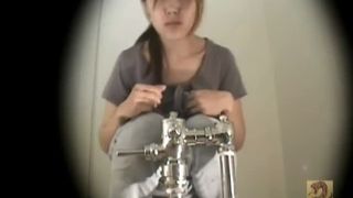 Sexy young girl shitting in public bathroom