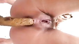 Hairy blonde milf pooping in close up